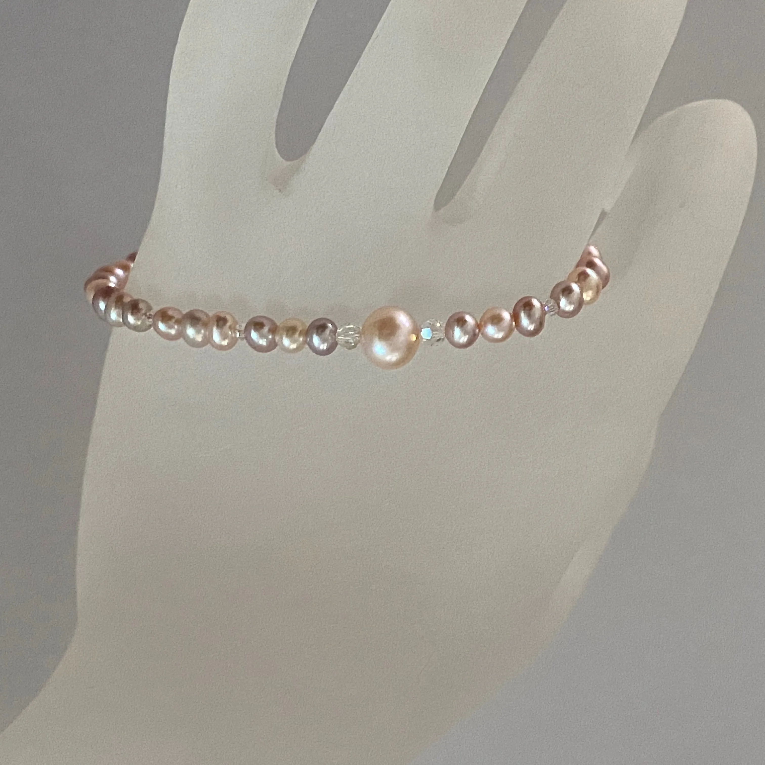 Arpaia 7" stretch bracelet with natural pastel color freshwater cultured pearls and Swarovski crystal beads
