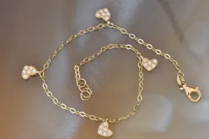 Gold bracelet with heart charm