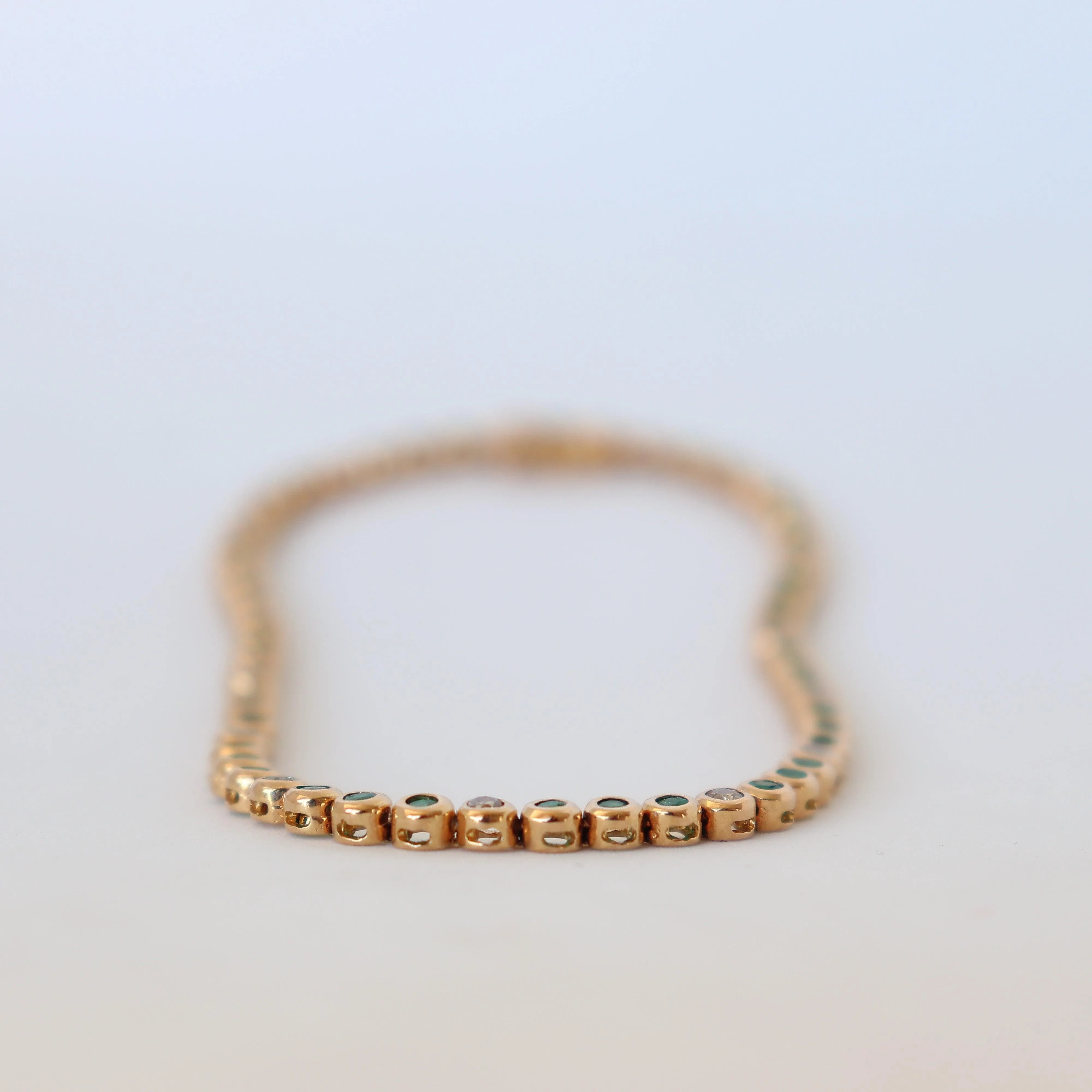 Yellow Gold Emerald and Diamond Bezel-set Tennis Bracelet